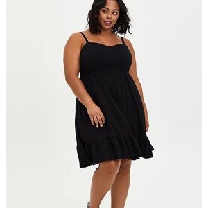 Black textured stretch rayon smocked skater dress